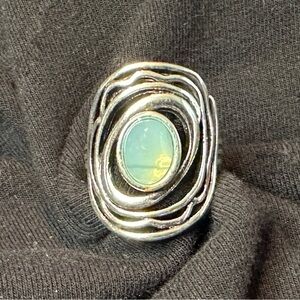 Decorative silver oval ring with aqua stone